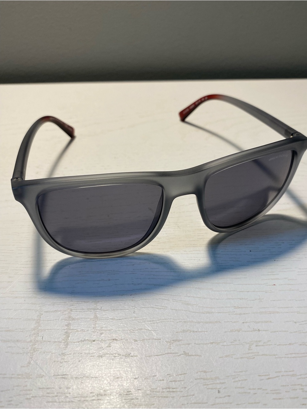 Armani Exchange Men’s Translucent Gray Sunglasses with Red Temple Tip